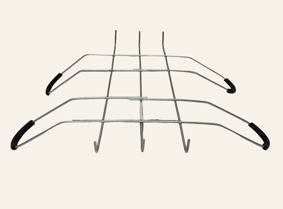 Metal wire rack with black handles on a white background