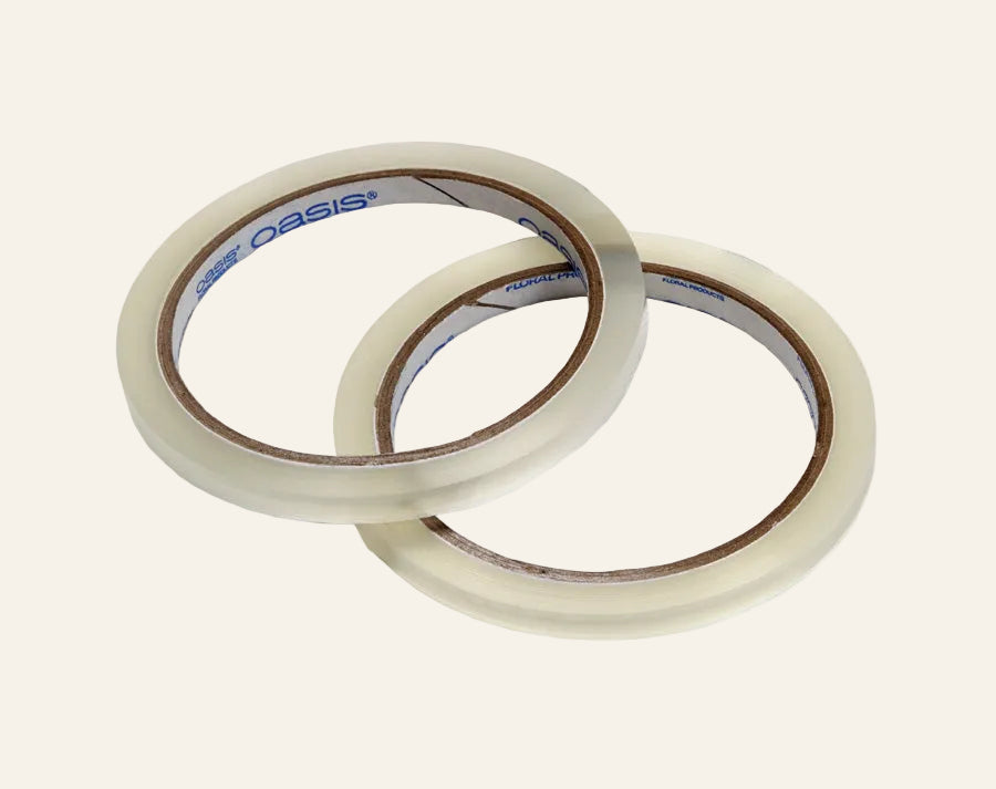 Two rolls of clear tape with a brand label on a white background