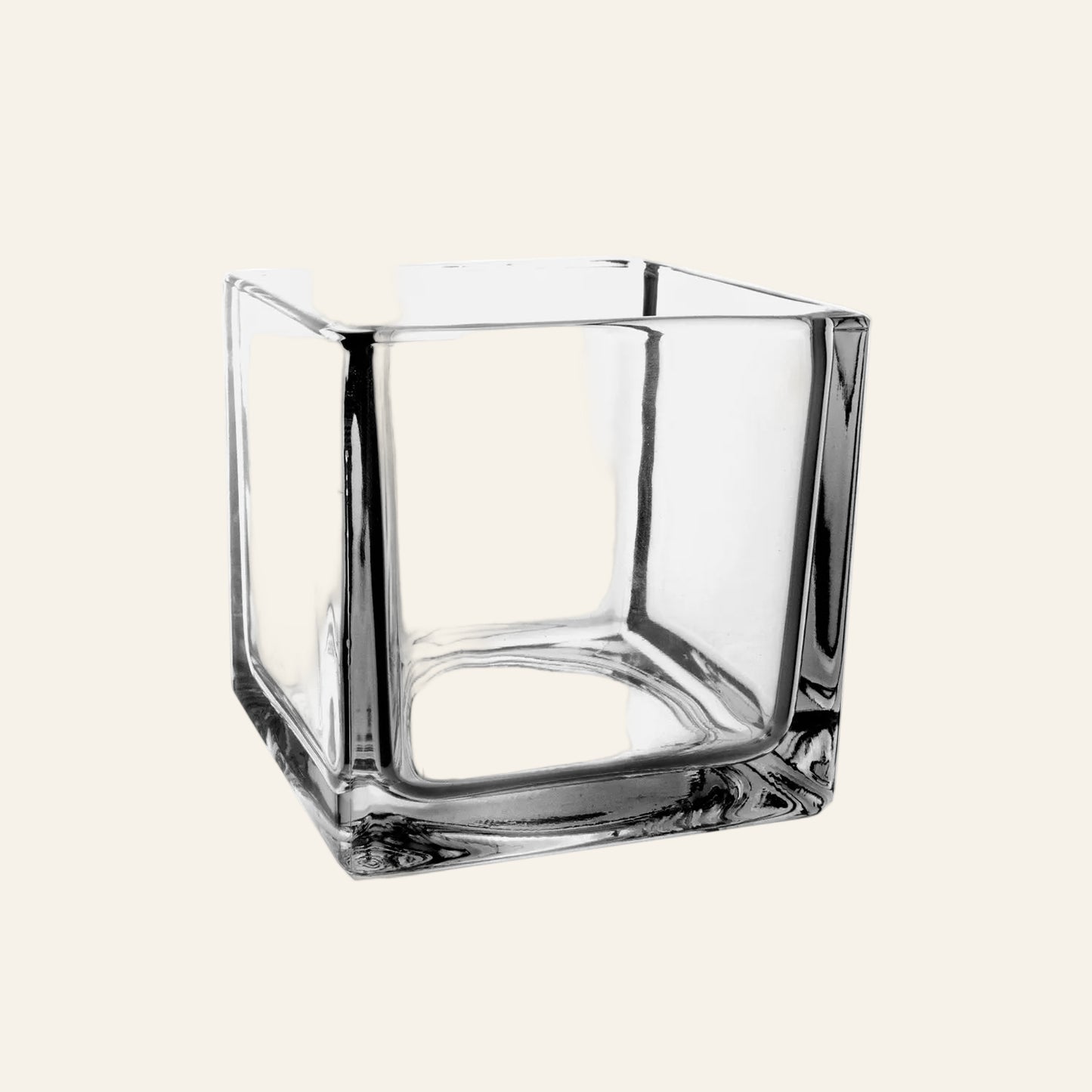 Clear glass square vase on a white background