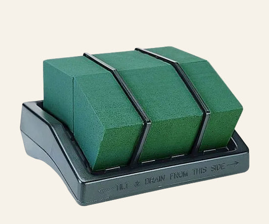 Green foam on a gray stand with text on a white background