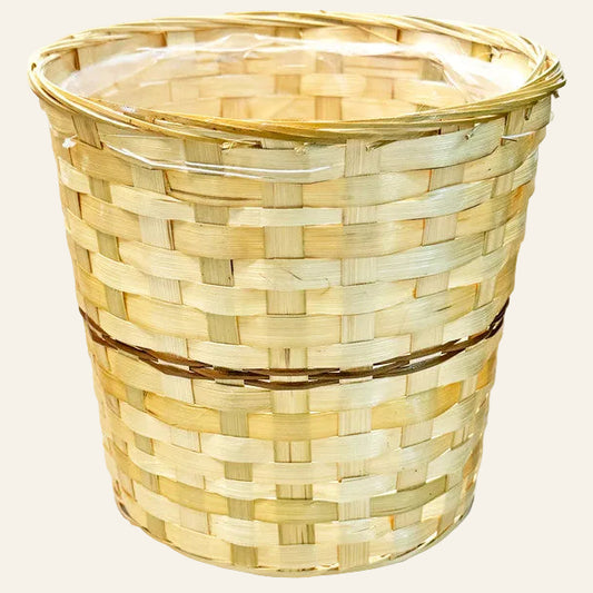 Woven bamboo basket with a clear lid on a white background