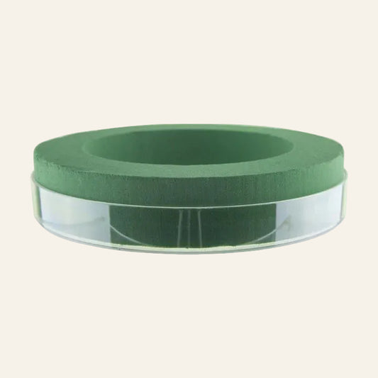 Green floral designer ring on a white background