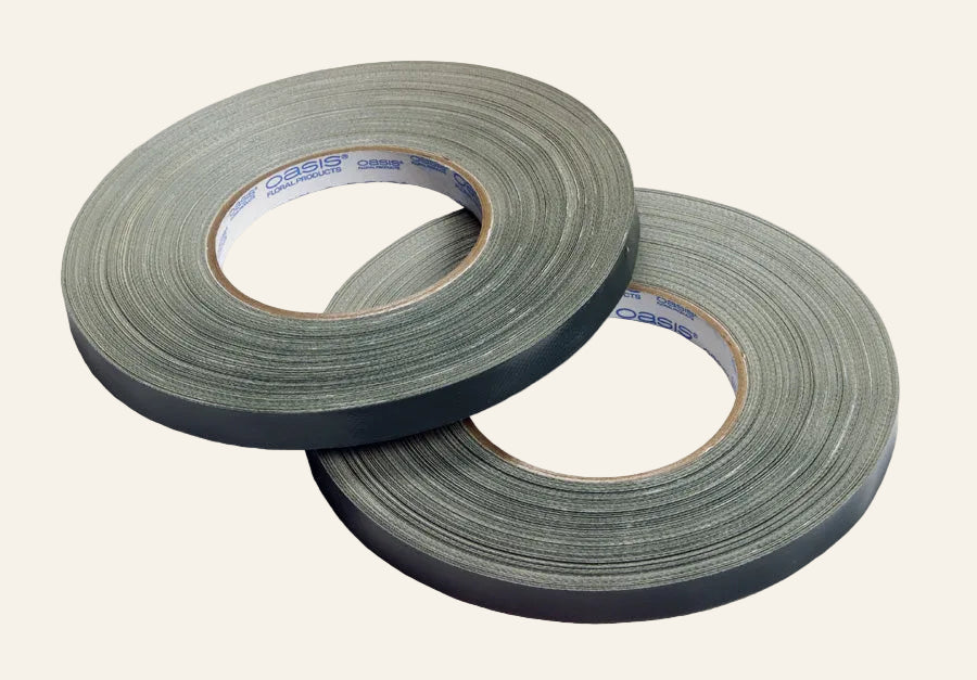Two rolls of gray tape on a white background