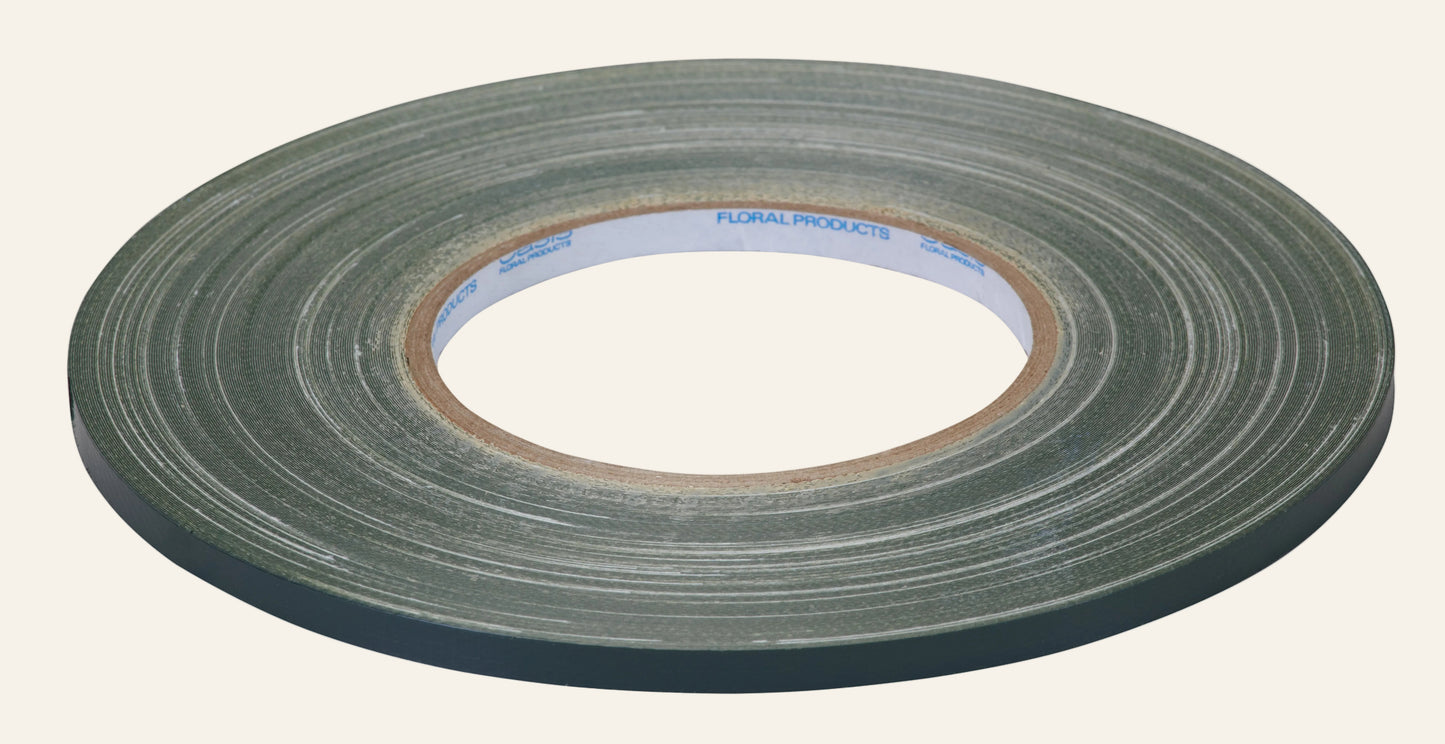 Roll of green floral tape on a white background