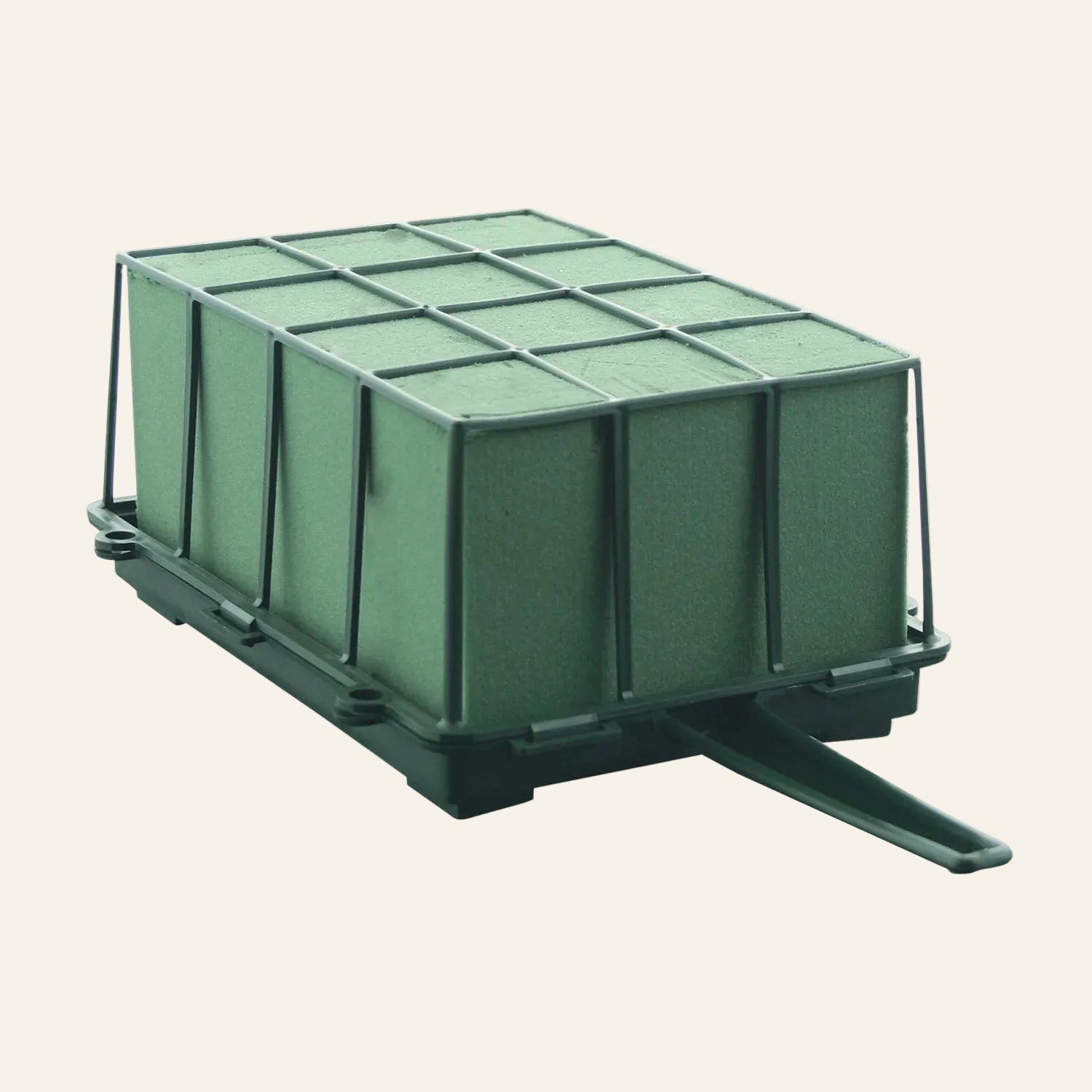 Green floral foam cage on white background