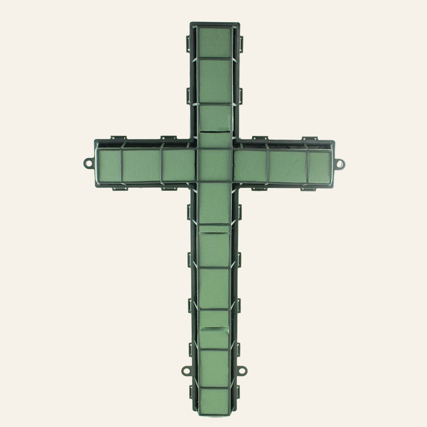 Green cross-shaped wreath on a white background