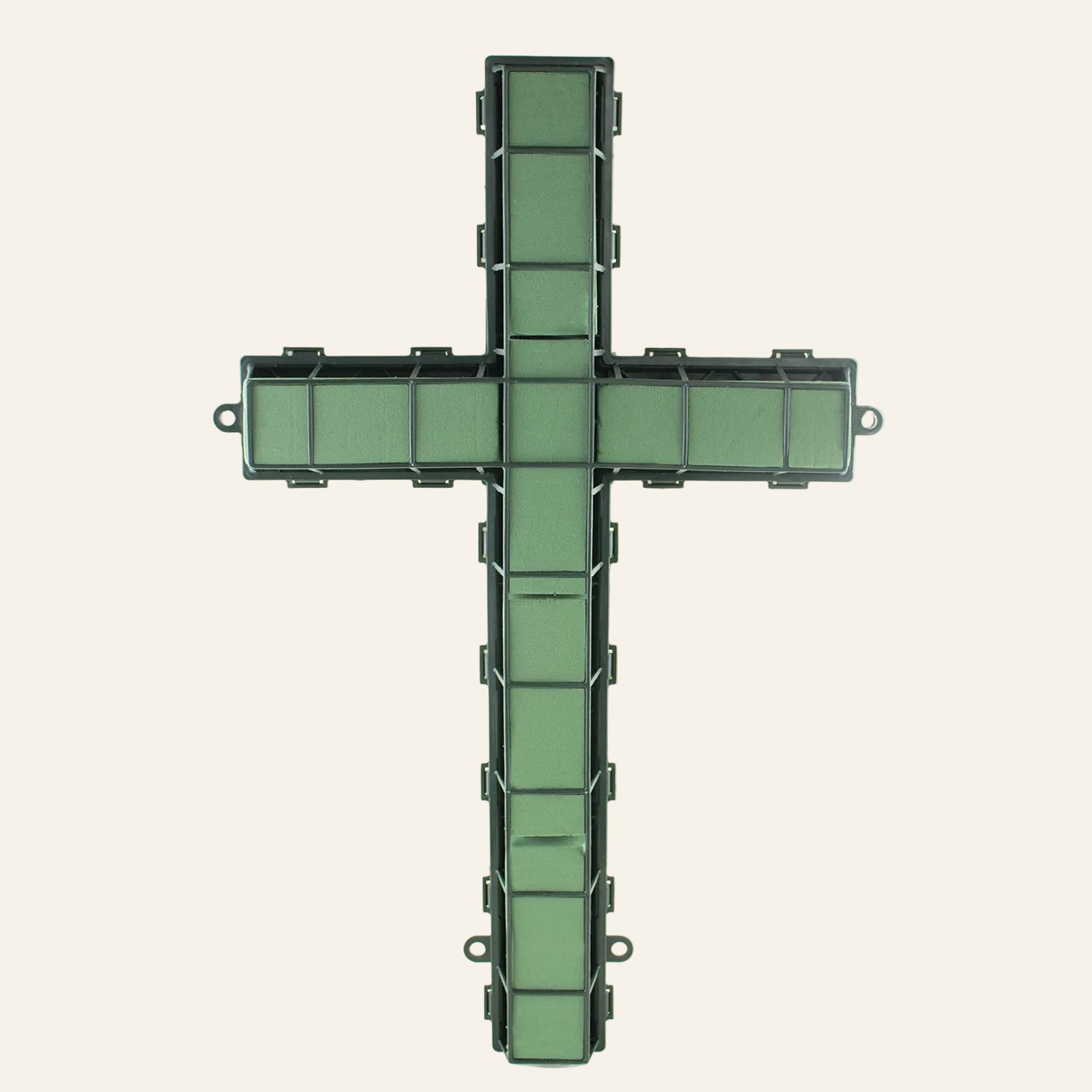 Green cross-shaped wreath on a white background