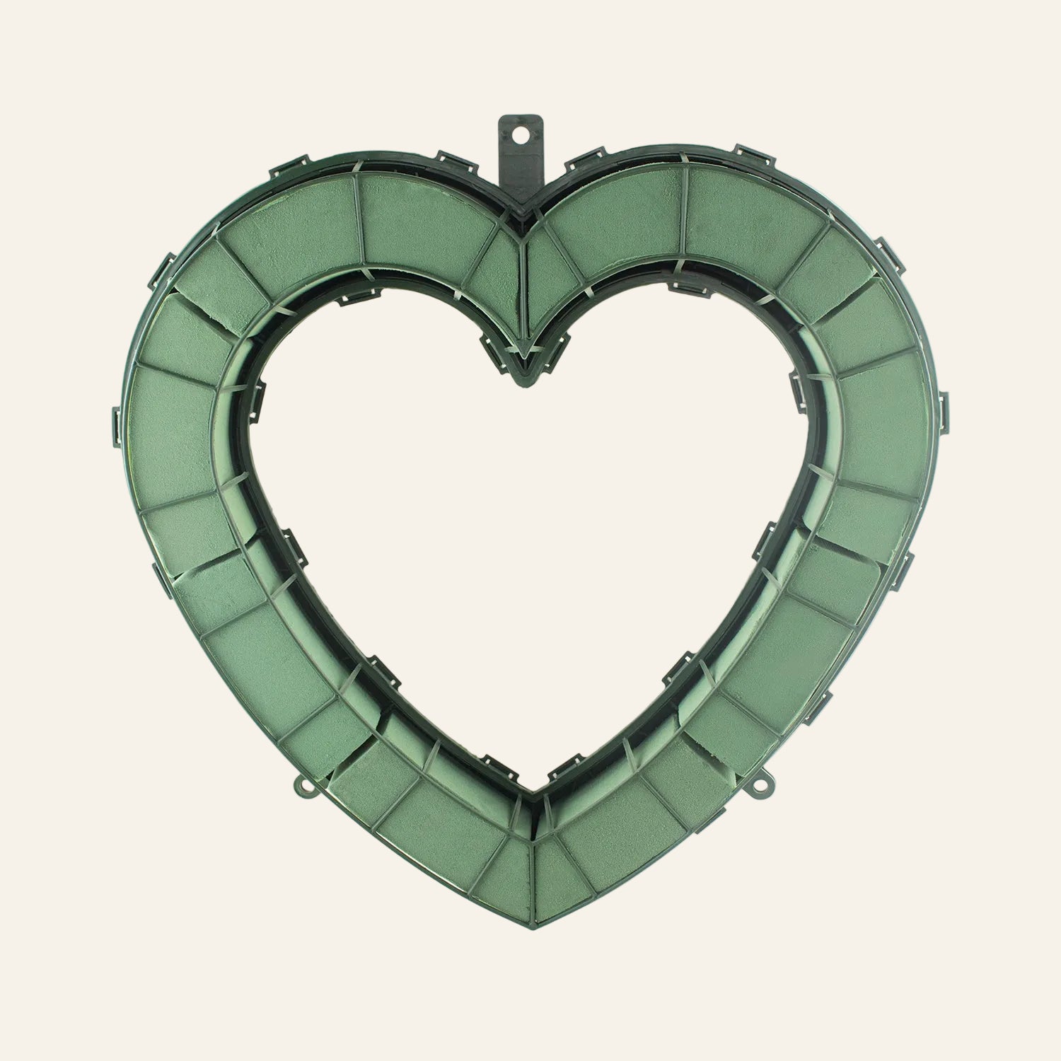 Heart-shaped green wreath on a white background