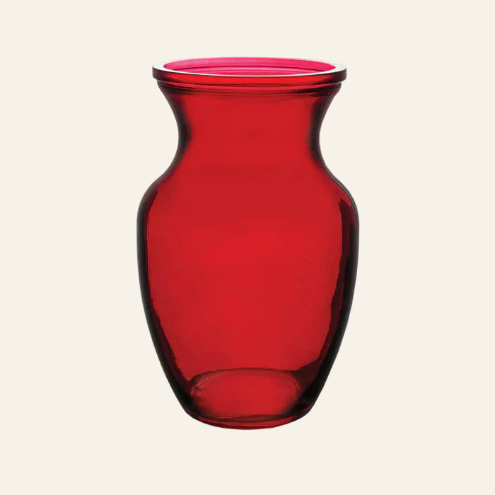 Red glass vase on a white background