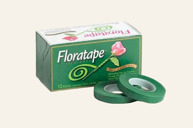 Box of Floratape with two rolls of green tape on a white background