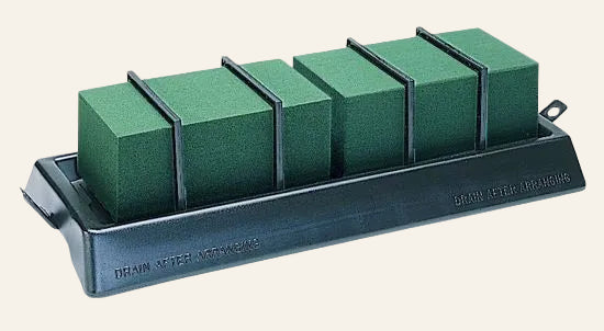 Green foam on a stand against a white background