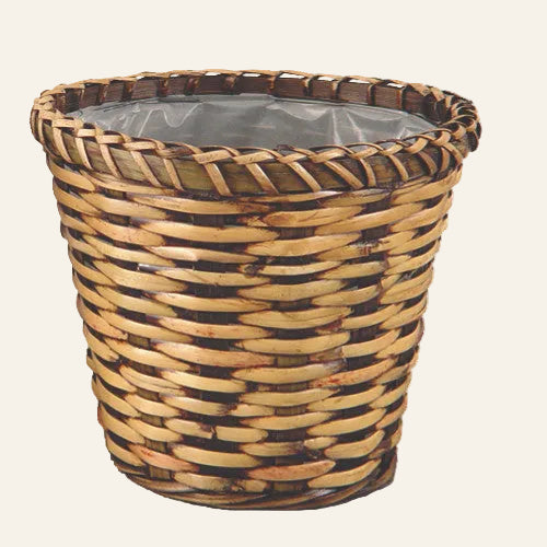 Wicker basket with a clear liner on a white background