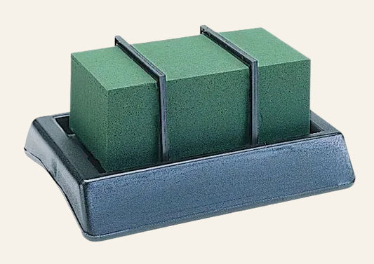 Green foam on a gray stand against a white background