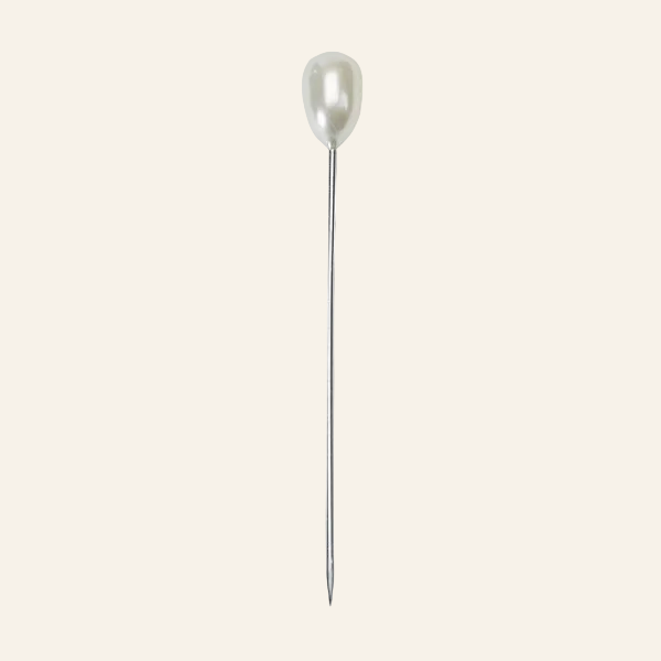 Pearl pin on a white background