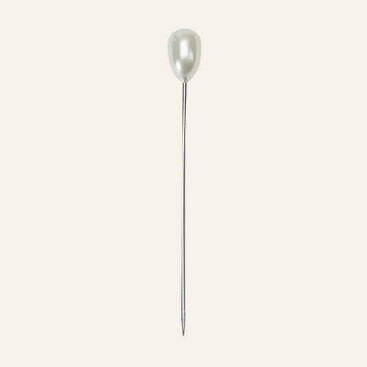 Pearl pin on a white background