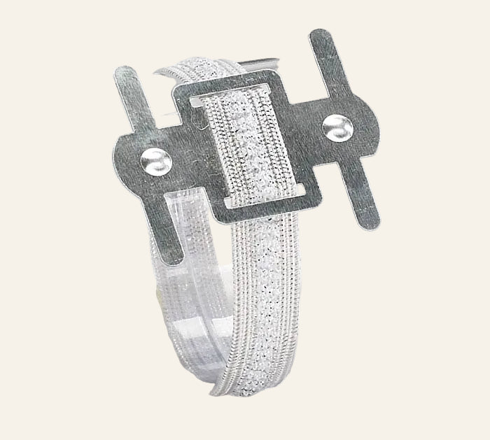 Metal clip with a woven strap on a white background
